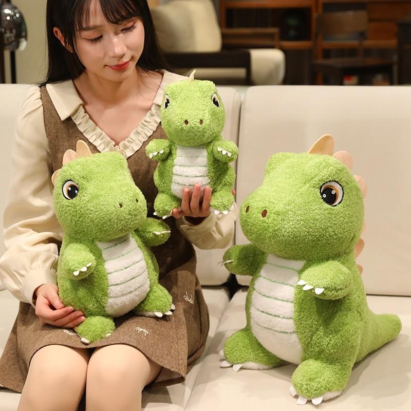 Cute green dinosaur plush toy with adorable, big eyes and endearing expressions, perfect for kids. Soft and comfortable, it can be used as a sofa cushion. A fun gift for children’s festivals, birthdays, or Christmas.