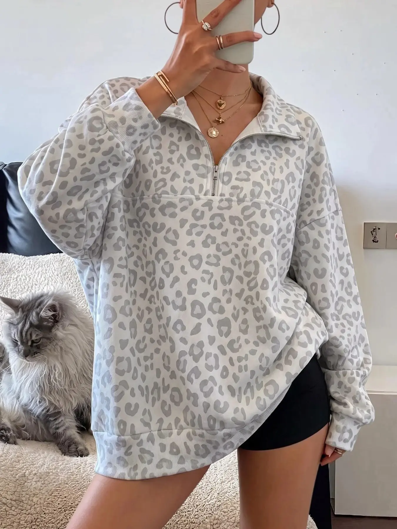 Semi-zip mock neck pullover loose sweatshirt, leopard print, dropped shoulder silhouette, fleece-lined for warmth and comfort, Y2K streetwear style, preppy aesthetic, ideal for autumn/winter outfits, loungewear, Casual, and everyday street style