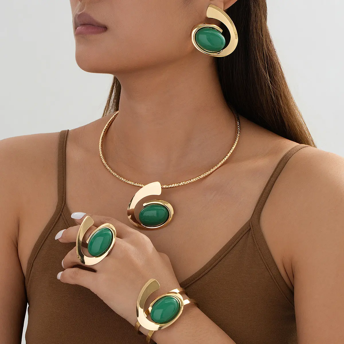 A set of unique and exaggerated alloy gemstone necklace, earrings, bracelet, and ring women's jewelry set gift