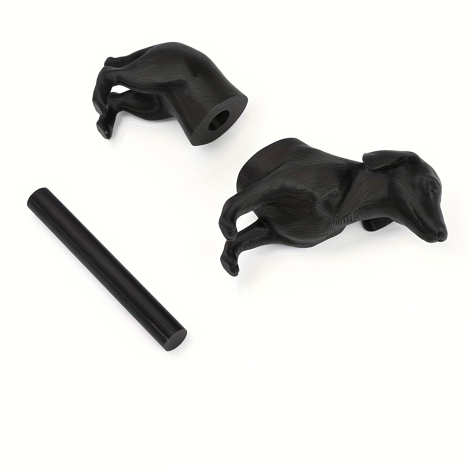 A humorous sausage dog-themed toilet paper holder - an independent black roll holder featuring a cute dog design, made of sturdy plastic and also suitable for kitchen paper towels