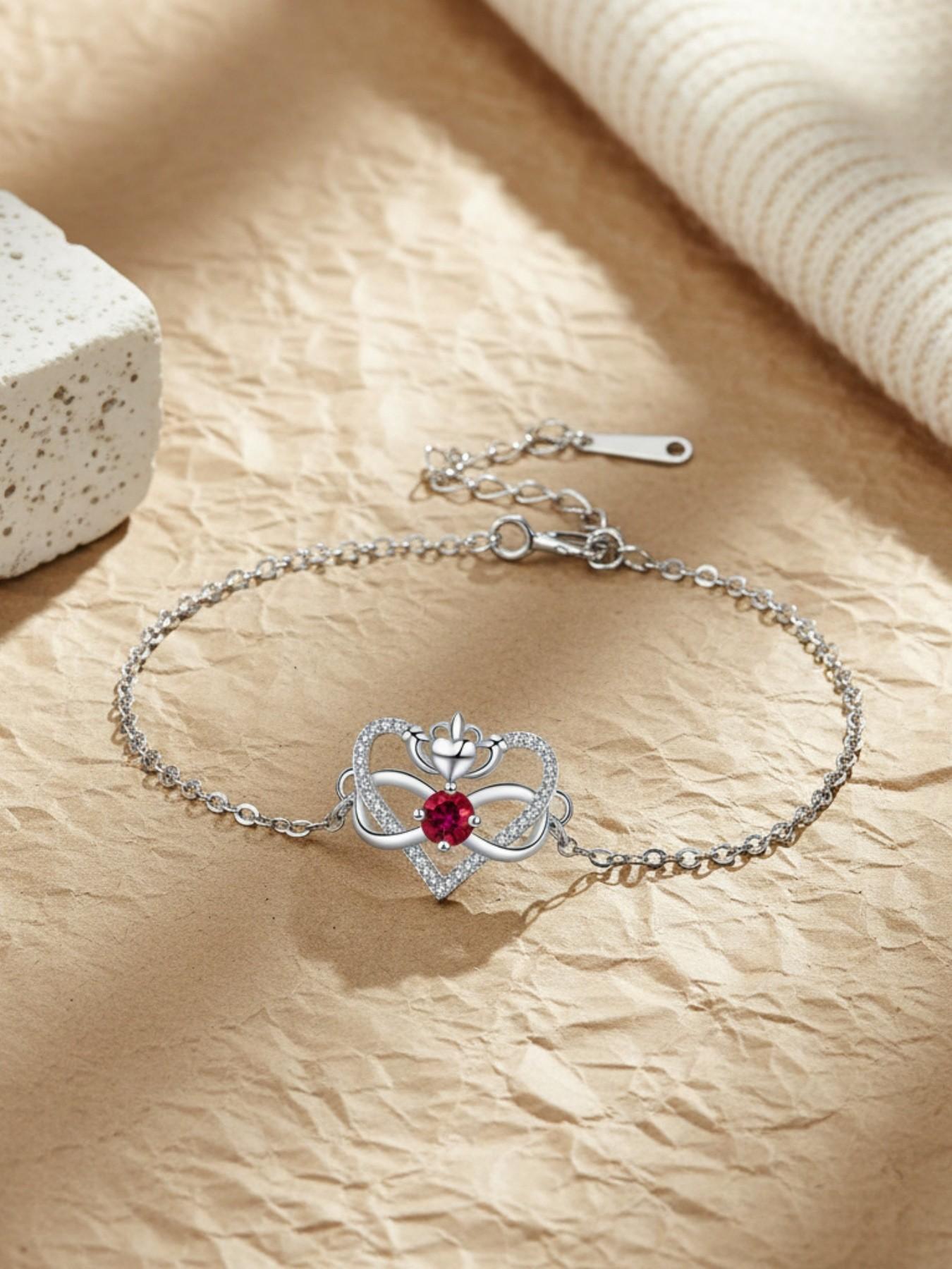 Heart Crown Queen · Ruby Bracelet Elegant heart-shaped bracelet with sparkling zircon infinity symbol, stylish and versatile.Paired with a surprise double-door preserved rose jewelry gift box.Ideal gift for birthdays, Mother’s Day and Valentine’s Day.