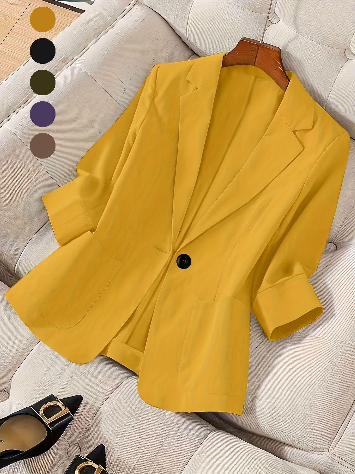 A women's solid color lapel single-breasted single-button mid-length sleeve double-pocket stylish blazer, suitable for spring and summer, appropriate for the workplace and daily wear.