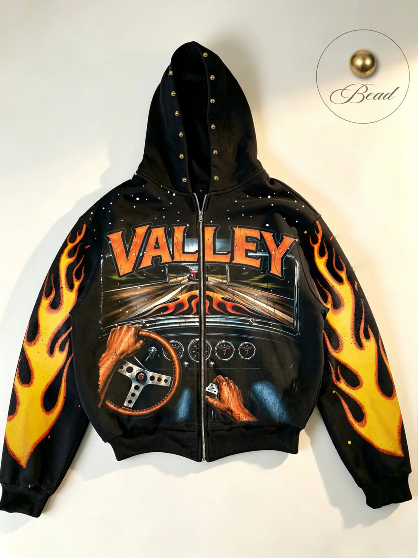 Street-style vintage racing-themed men’s hooded cardigan, featuring flame and "VALLEY" highway-inspired graphics, accented with rivets along the hood edge. Designed with a heavy-weight, loose, drop-shoulder fit—a trendy, unisex piece perfect for couples.