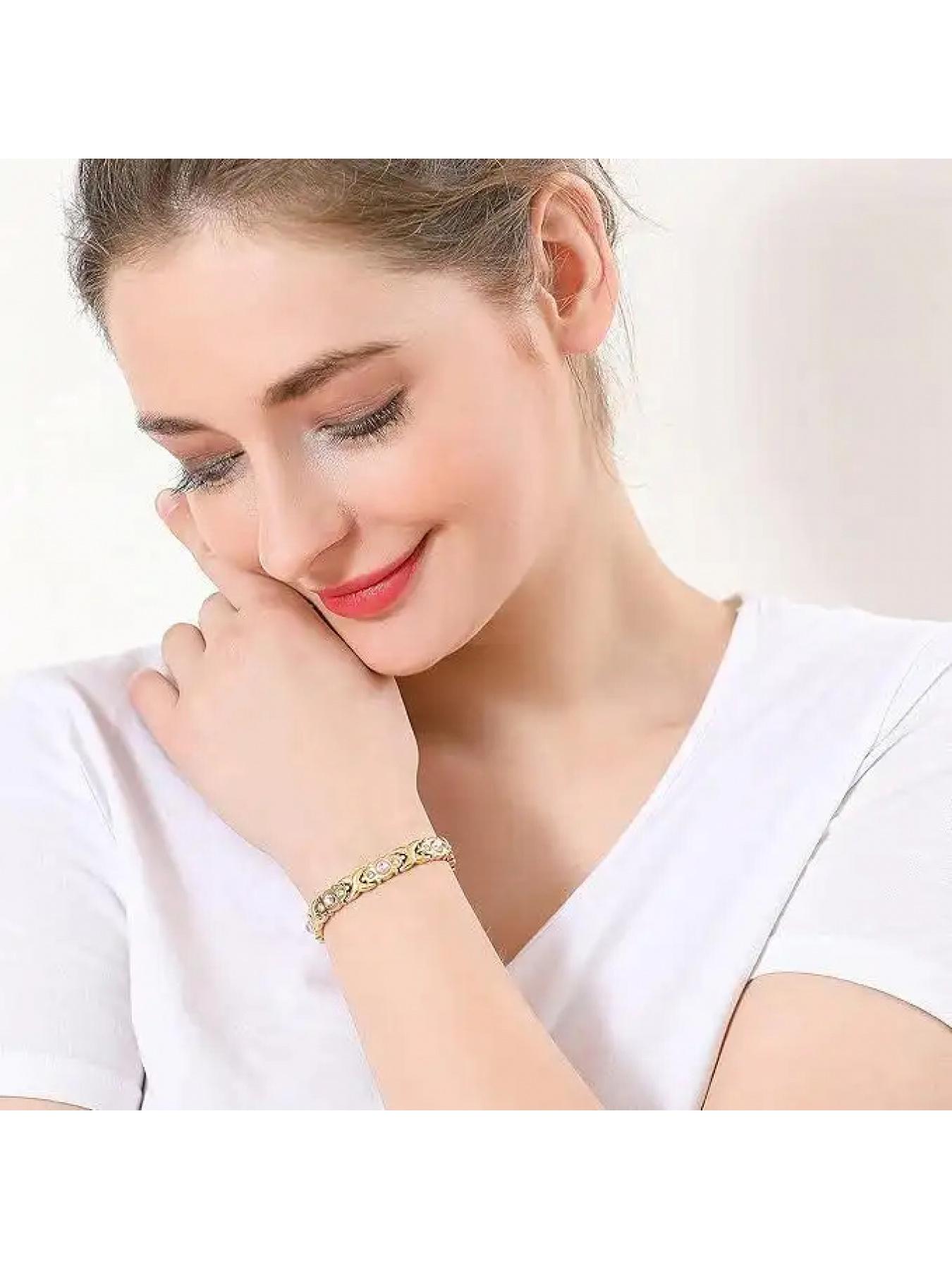 Pink crystal XOXO bracelet, available in silver and rose gold, featuring a classic XOXO design and sparkling pink crystals. Suitable for various styles of clothing.