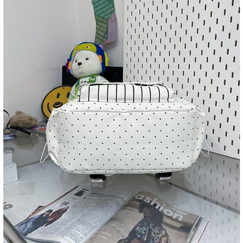 Women's piano-shaped backpack—a cute, polka-dot nylon bag that can be worn as a shoulder bag or backpack. It features an elegant, sweet style with a playful touch, making it perfect for school, commuting, shopping, travel, or as a holiday gift