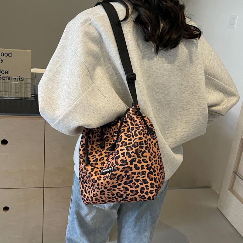 Women's Leopard Print Drawstring Bucket Bag, Lightweight Nylon Crossbody Shoulder Purse, Adjustable Strap, Casual All-Season Handbag