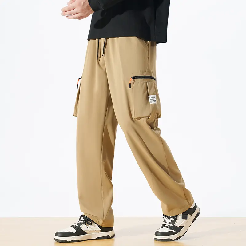 Men's Khaki Wide Leg Cargo Pants, Elastic Waist Drawstring Loose Baggy Trousers With Zipper Multi‑Cargo Pockets And Side Label, Casual Outdoor Streetwear Relaxed Fit Long Pants For Daily Travel Hiking Casual Outfits