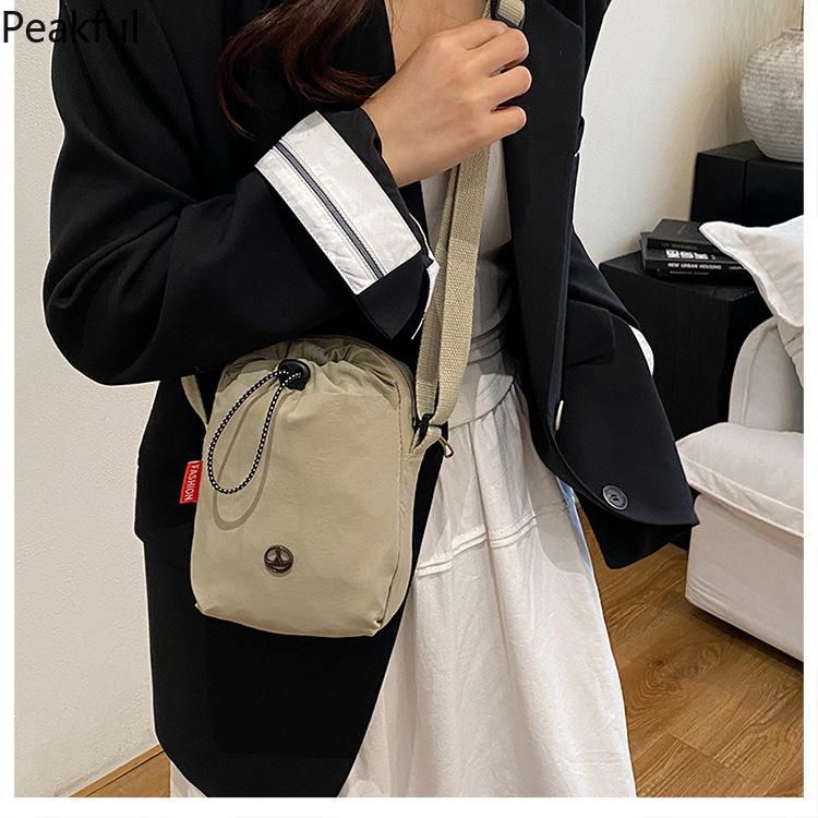 Viral Mini Drawstring Nylon Sling Bag, Fashion Casual Cinch Crossbody Purse, Lightweight Adjustable Strap Shoulder Bag, water-resistant fabric & multi-color options, ideal for travel, gym sessions and everyday hands-free use