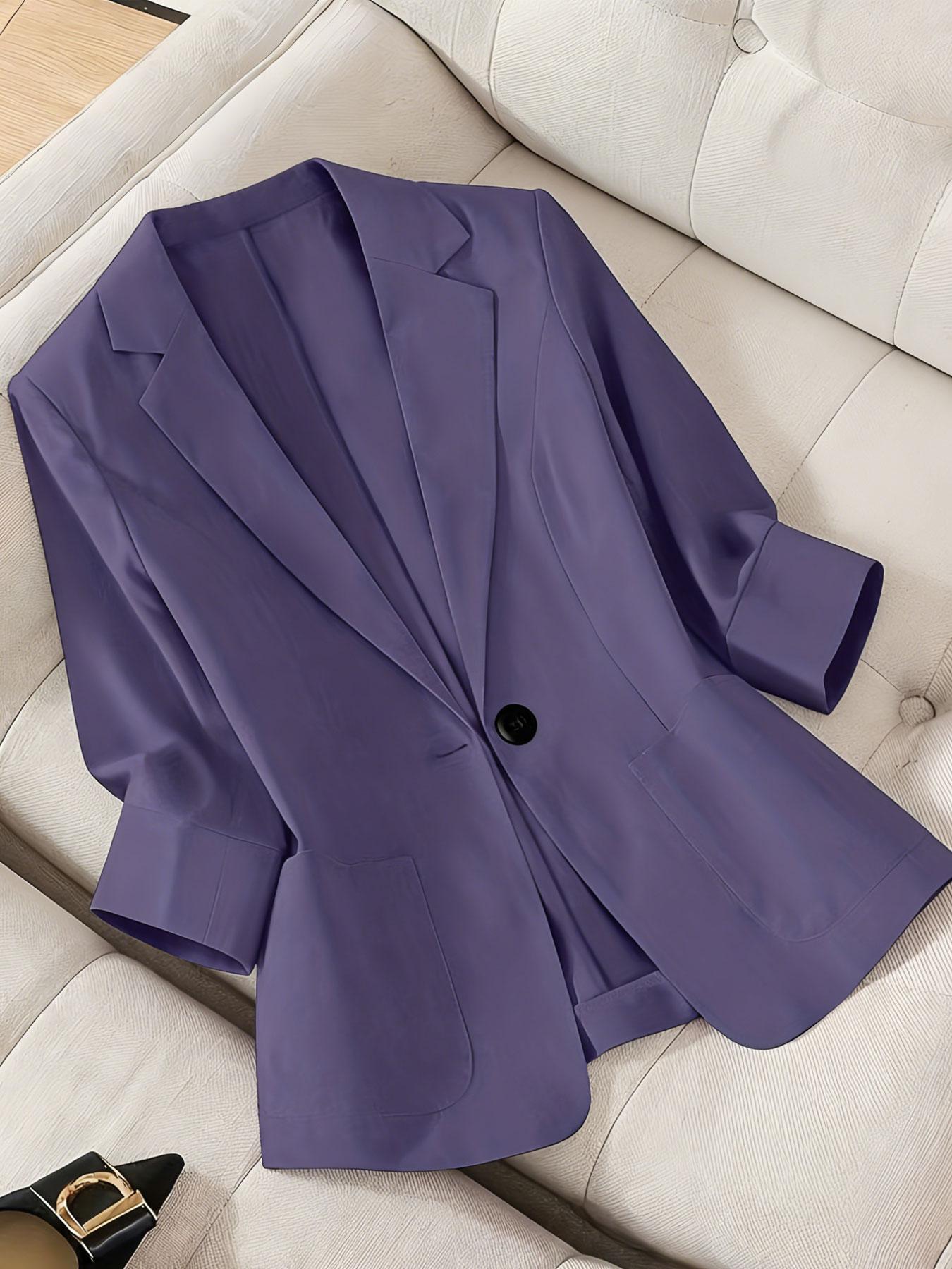 A women's solid color lapel single-breasted single-button mid-length sleeve double-pocket stylish blazer, suitable for spring and summer, appropriate for the workplace and daily wear.