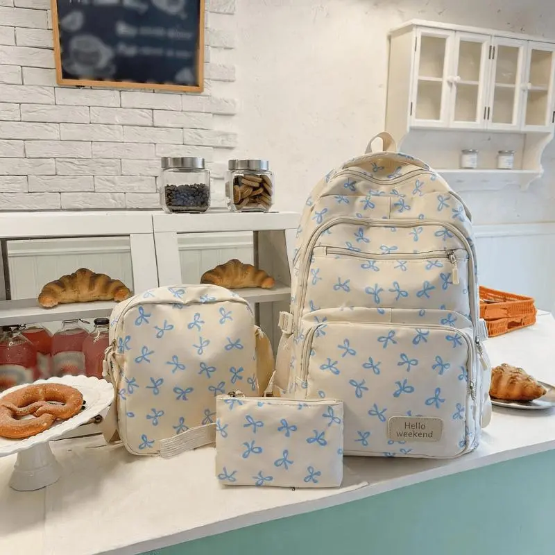 JSERYISGN You just found the cutest backpack set. Korean style bow print, lightweight design, and three pieces for all your needs. A stylish schoolbag for women who love simplicity.