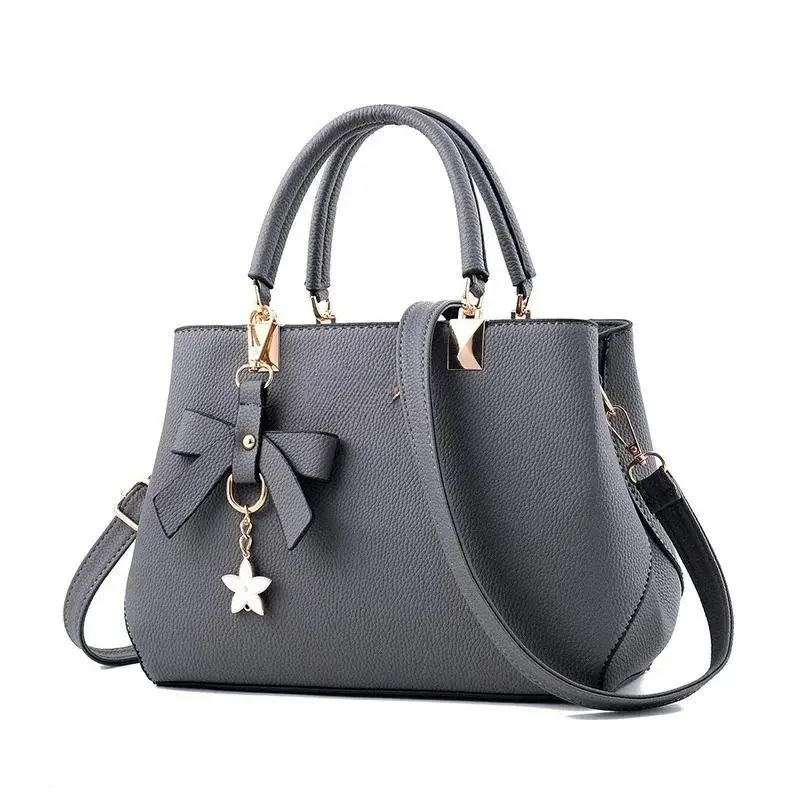 Female Minimalist Chic Floral Pendant Commuter Bag - Plain Design, Spacious Interior, Crossbody Tote, Casual Wear Ready for Work & Sports
