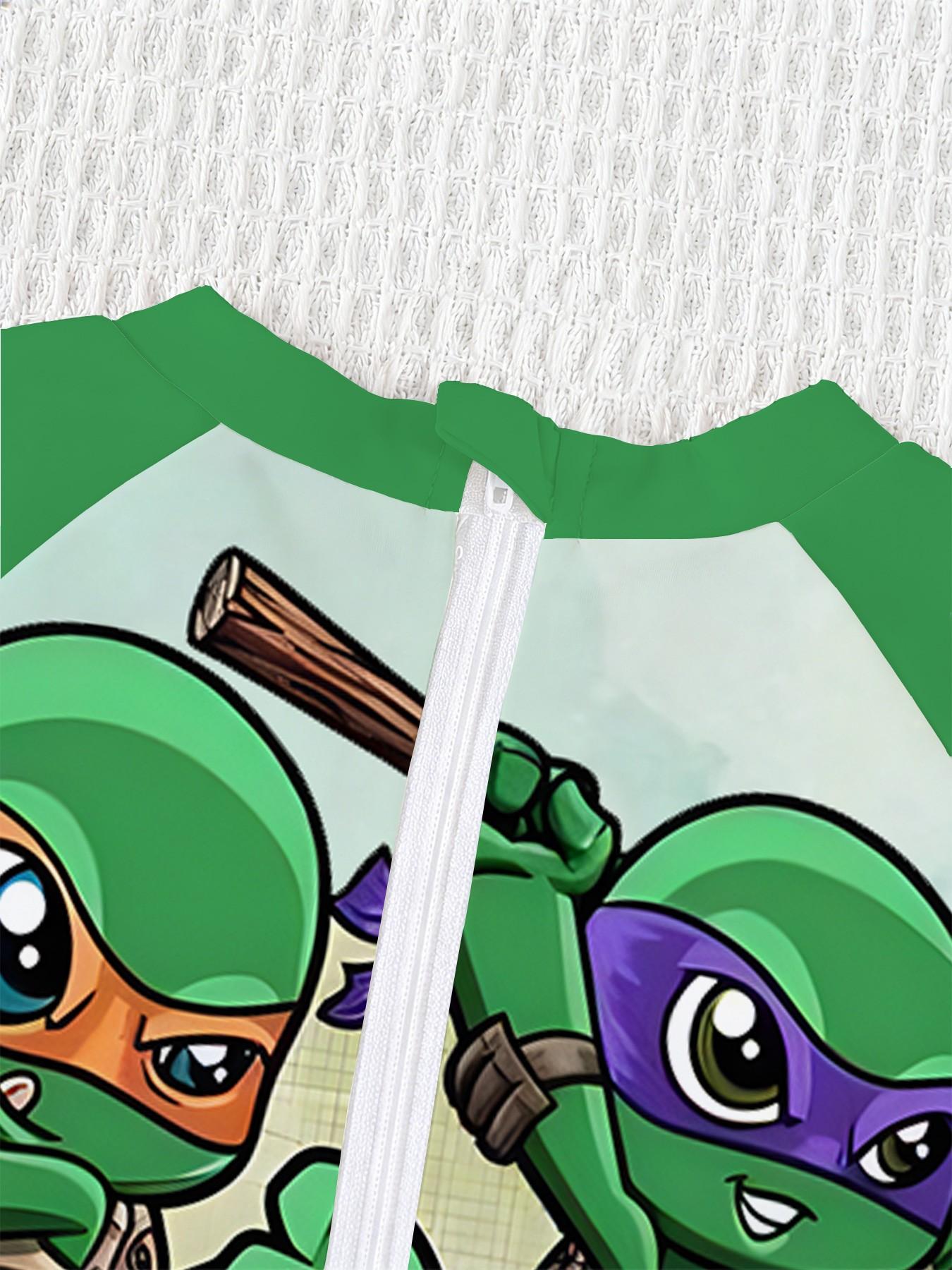 Boys' one-piece swimsuit "Chibi Ninja Turtles Team Edition" features all-over print of the four Chibi Ninja Turtles plus raglan green sleeves, cute and cool with sun protection, eye-catching for summer water play / beach vacations