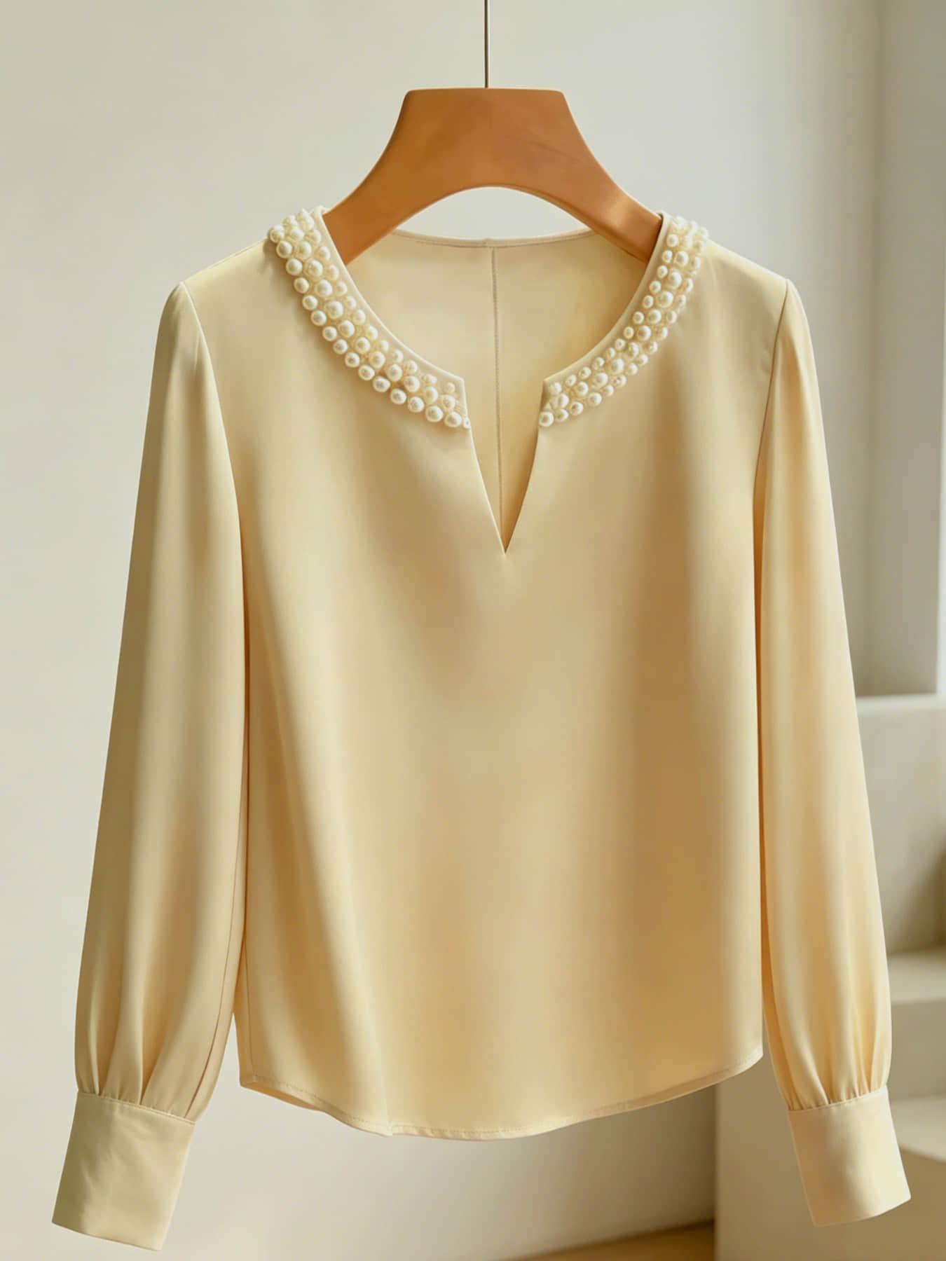 A women's pearl collar top, Blouse, with a V-neck small open neck, loose and versatile, showing off a slimming temperament. It is suitable for summer, business negotiations, customer meetings, commuting