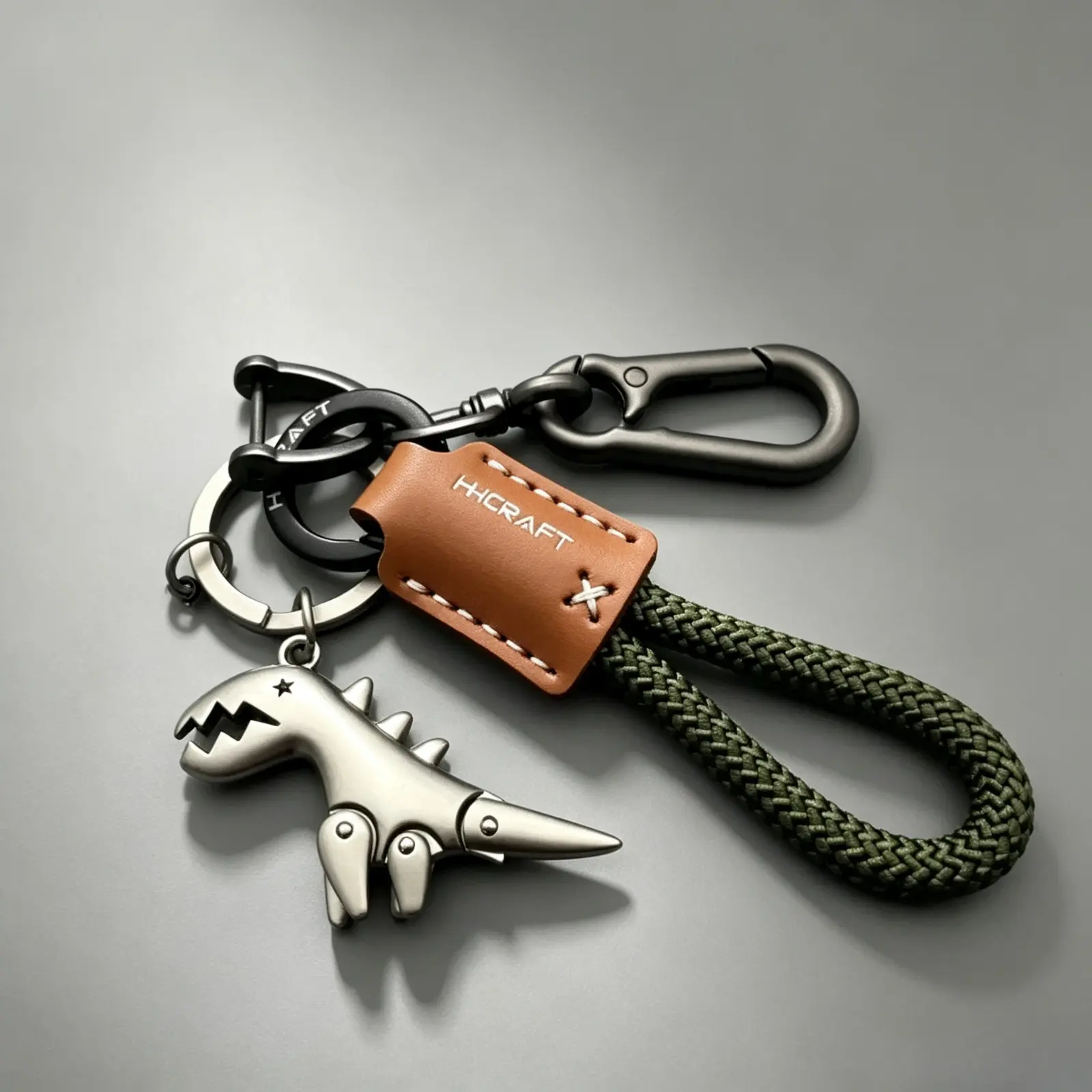Movable Metal Dinosaur Keychain, Braided Rope Leather Tag Car Key Holder, Minimalist Alloy Dino Pendant Key Ring, Anti-lost Carabiner Key Chain, Fashion Bag Accessories Gift, For Men Women