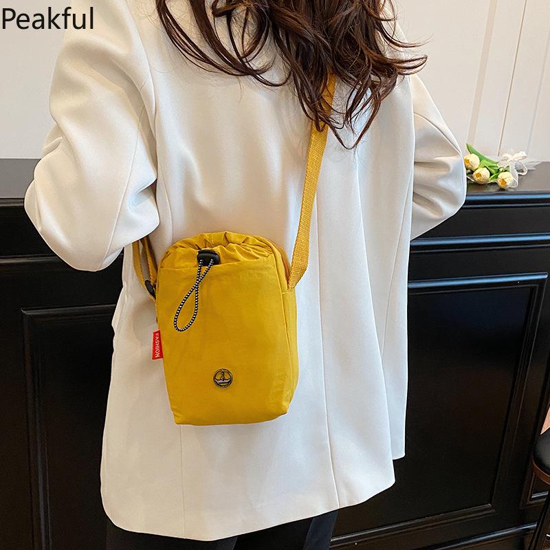 Viral Mini Drawstring Nylon Sling Bag, Fashion Casual Cinch Crossbody Purse, Lightweight Adjustable Strap Shoulder Bag, water-resistant fabric & multi-color options, ideal for travel, gym sessions and everyday hands-free use