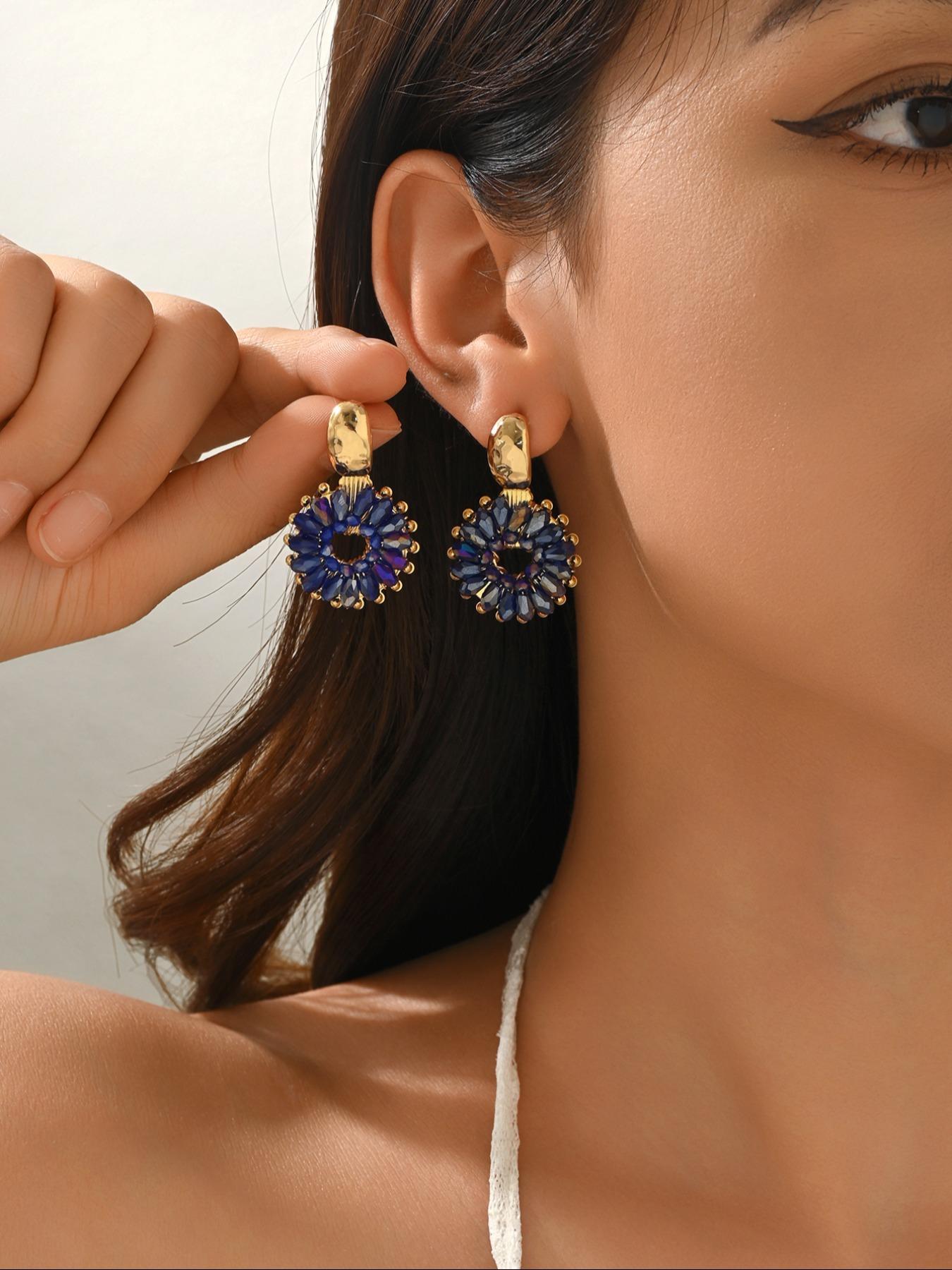 A pair of handcrafted, beaded dangle earrings featuring a chic Bohemian resort style. These round earrings exude an elegant, refined, and understated aesthetic with a premium feel, available in a variety of colors. for women to wear on any occasio