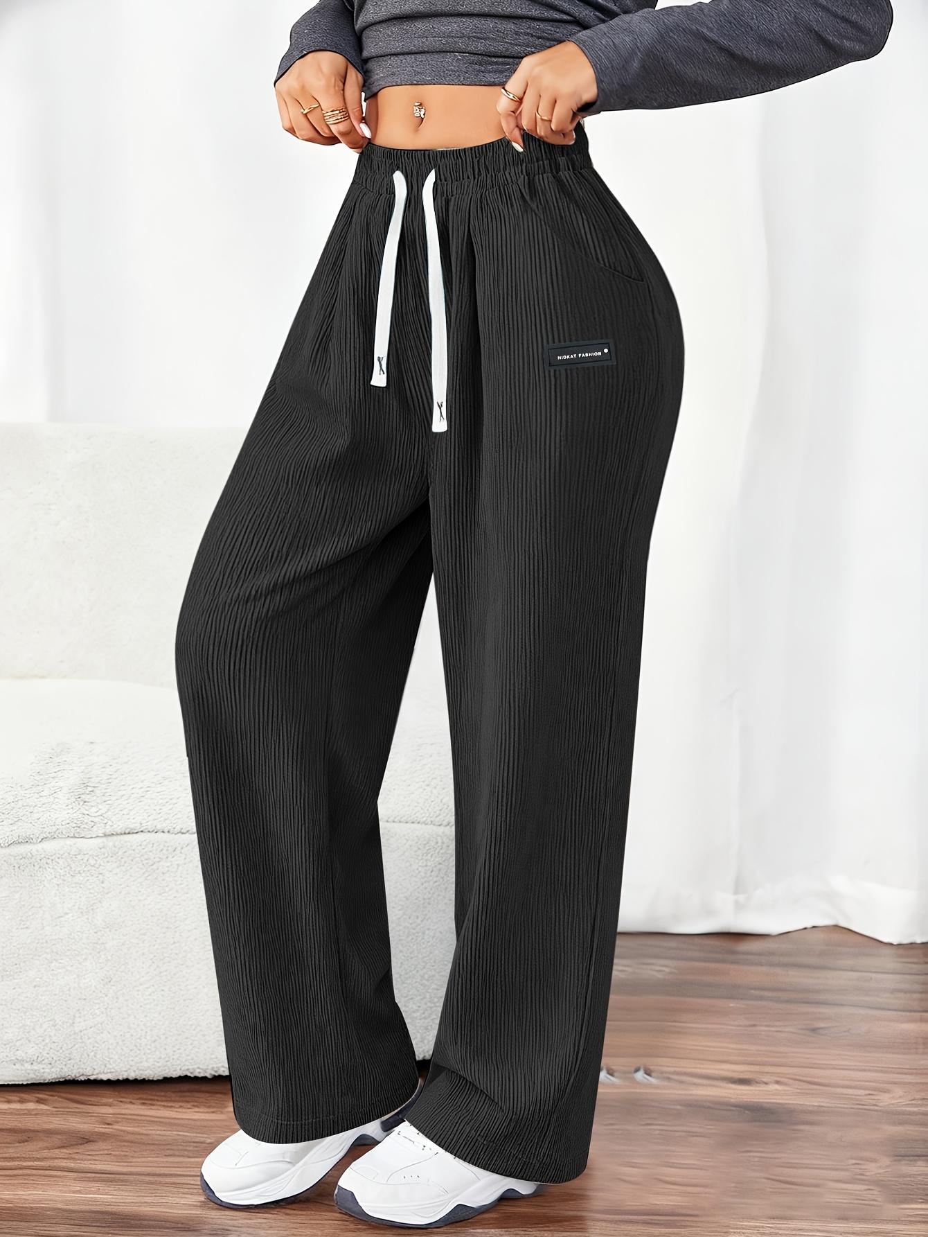 Women's Corduroy Jogger Pants for Spring and Autumn, featuring solid colors with drawstring pockets. Crafted from soft and comfortable fabric, these pants are ideal for everyday casual wear.