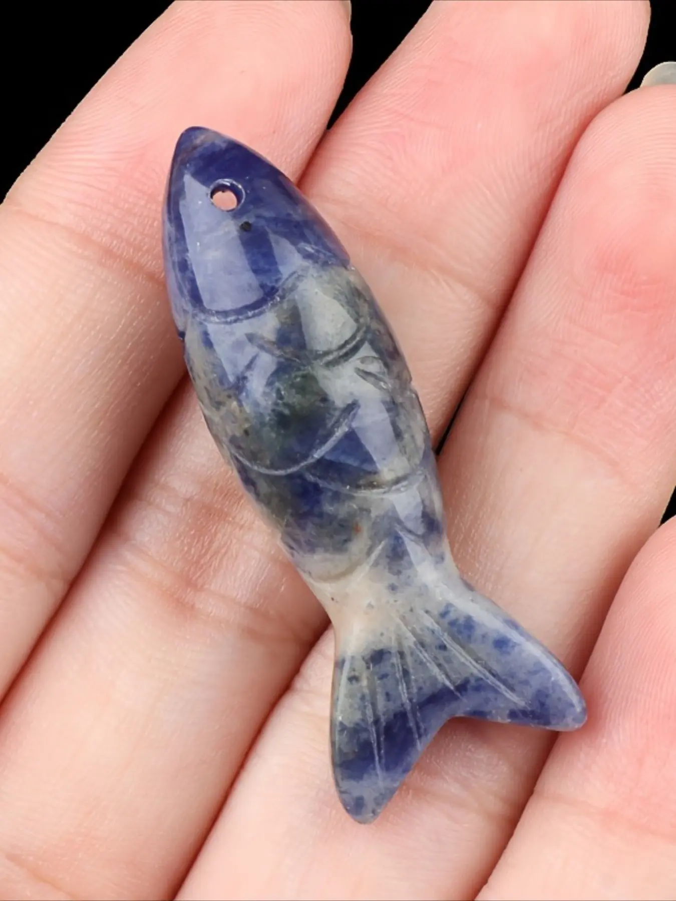 A natural crystal fish ornament. Its unique shape showcases distinctive taste. This miniature Crystal Ornaments