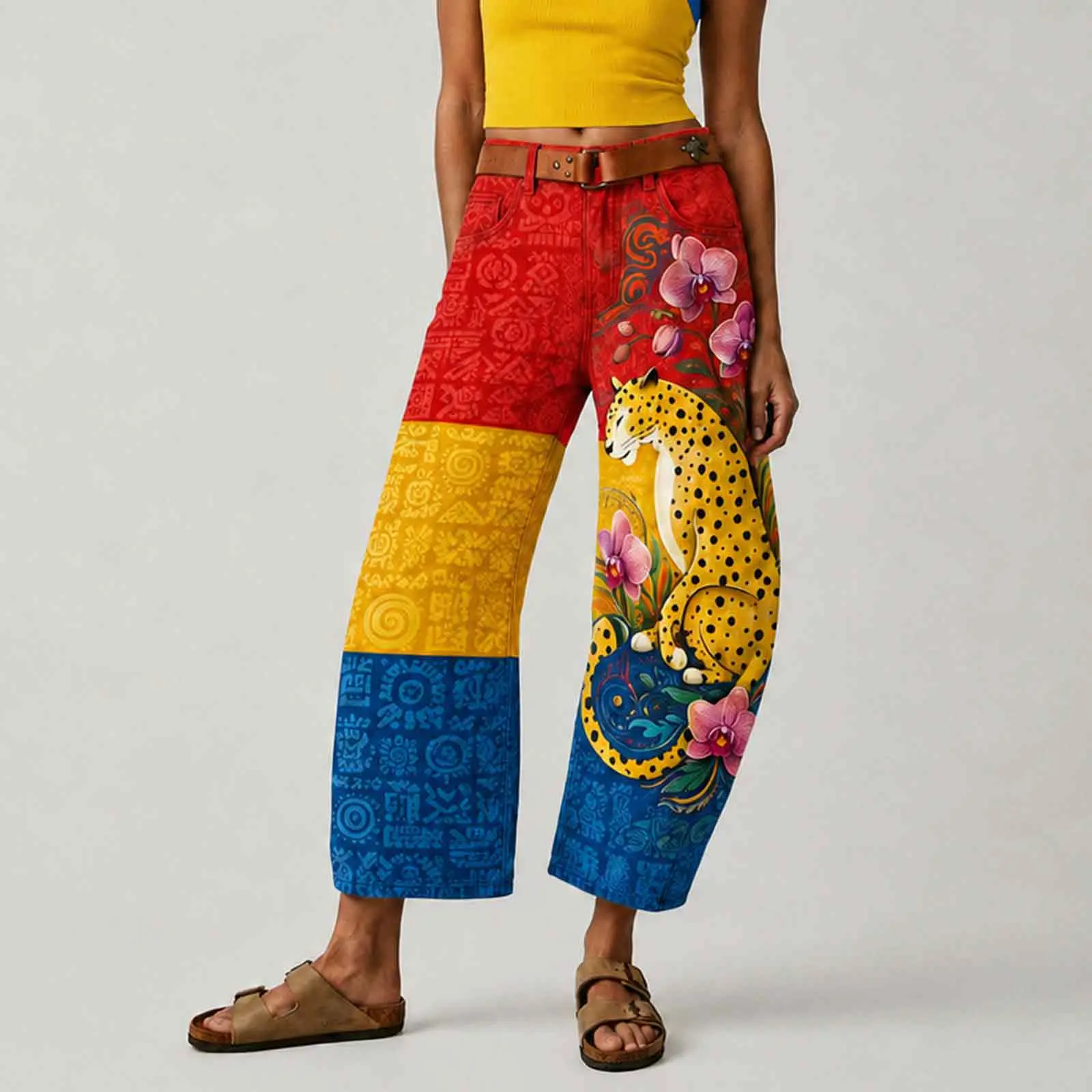 Women's colorful printed wide-leg trousers featuring a high-waisted bohemian pattern and Colombian-inspired color palette—perfect for summer vacations, these tropical-style pants combine leopard and floral prints.