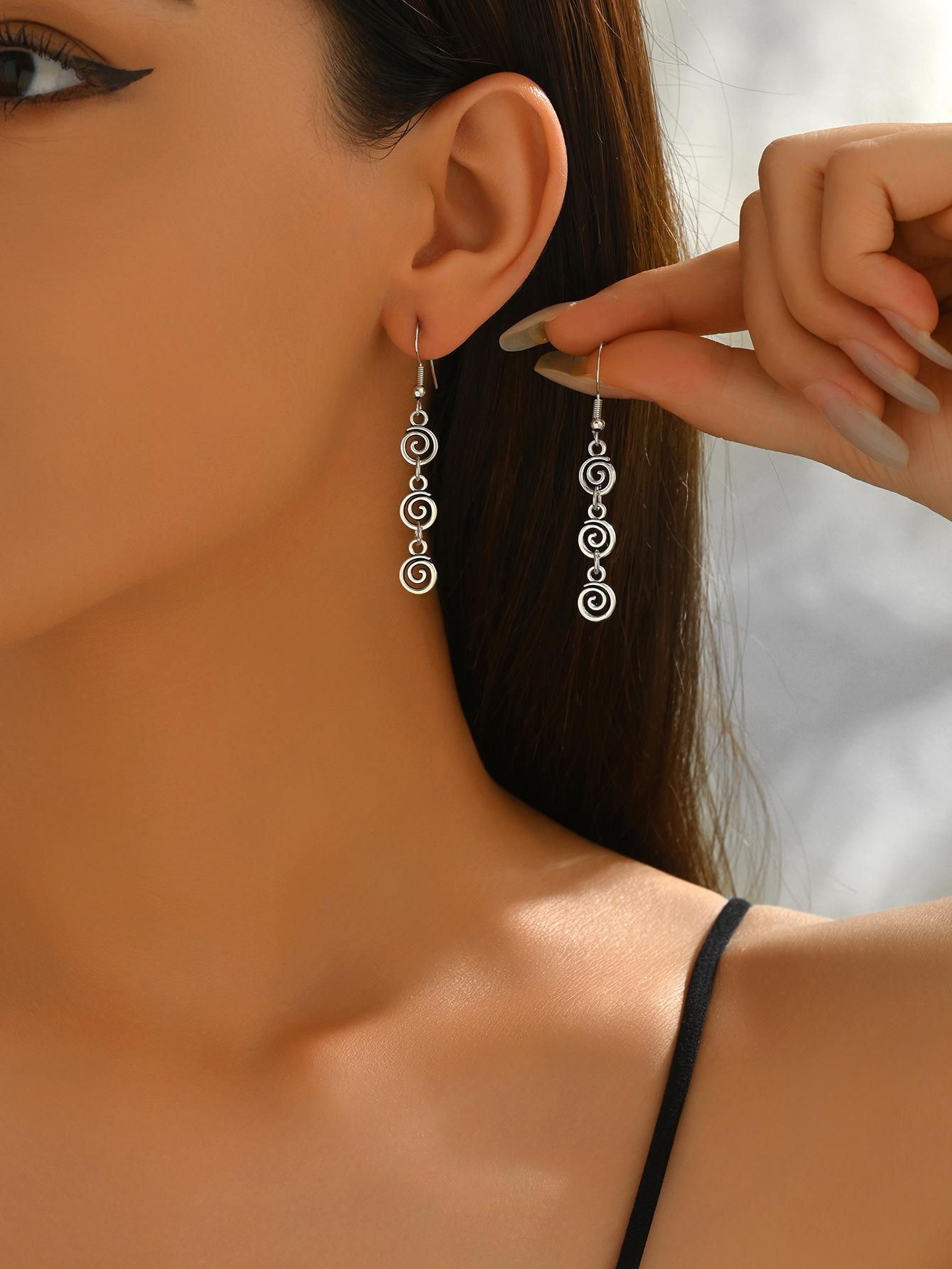 Vintage spiral earrings with distressed design, mosquito incense holder pendant, swirling long fringed earrings