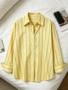 A women's fashionable yellow striped minimalist style shirt with a refreshing color scheme and a hanging fabric that is comfortable and breathable, suitable for commuting, playing, indoor and outdoor wear