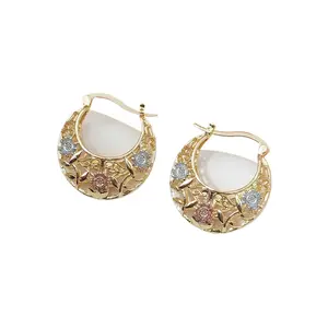Women's tri-color metal hoop earrings featuring a vintage openwork floral and chunky crescent design with saddle-style clasps; suitable as an anniversary or birthday gift.
