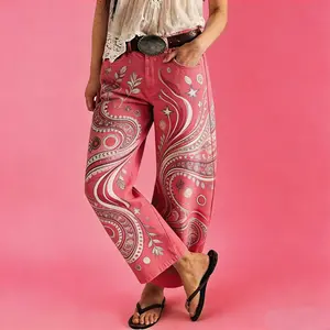 Women's vintage-wash wide-leg jeans; Y2K-style loose-fitting trousers; soft pink base with a bohemian floral print; suitable for year-round outdoor activities and streetwear styling.