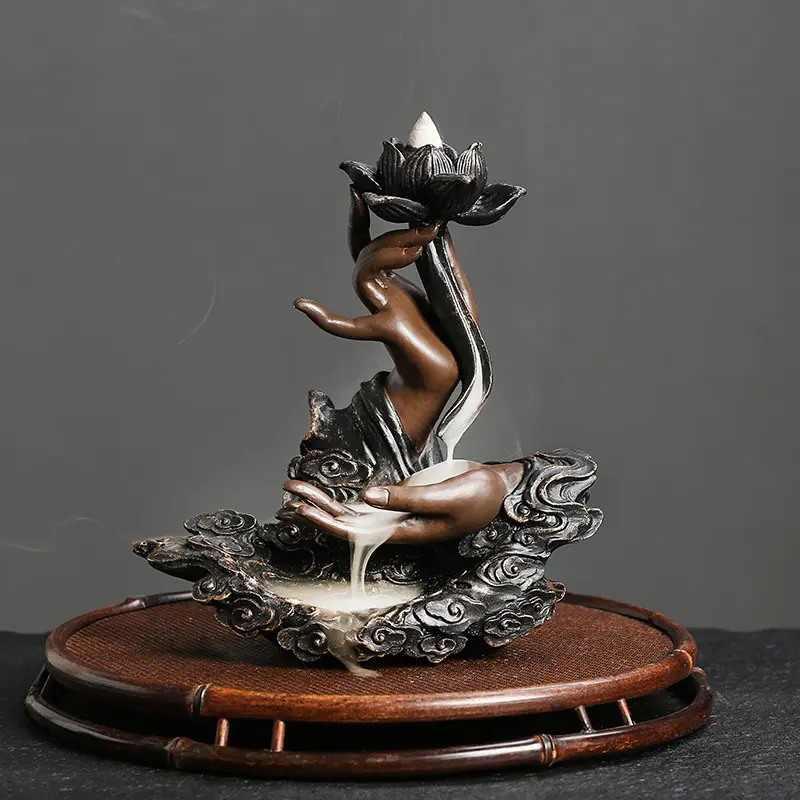 Mini handmade resin backflow incense burner, Incense Holder, with unique lotus and Buddha hand waterfall design. Smoke flows down like running water to soothe mind and body. A feng shui art ornament that creates a tranquil home atmosphere