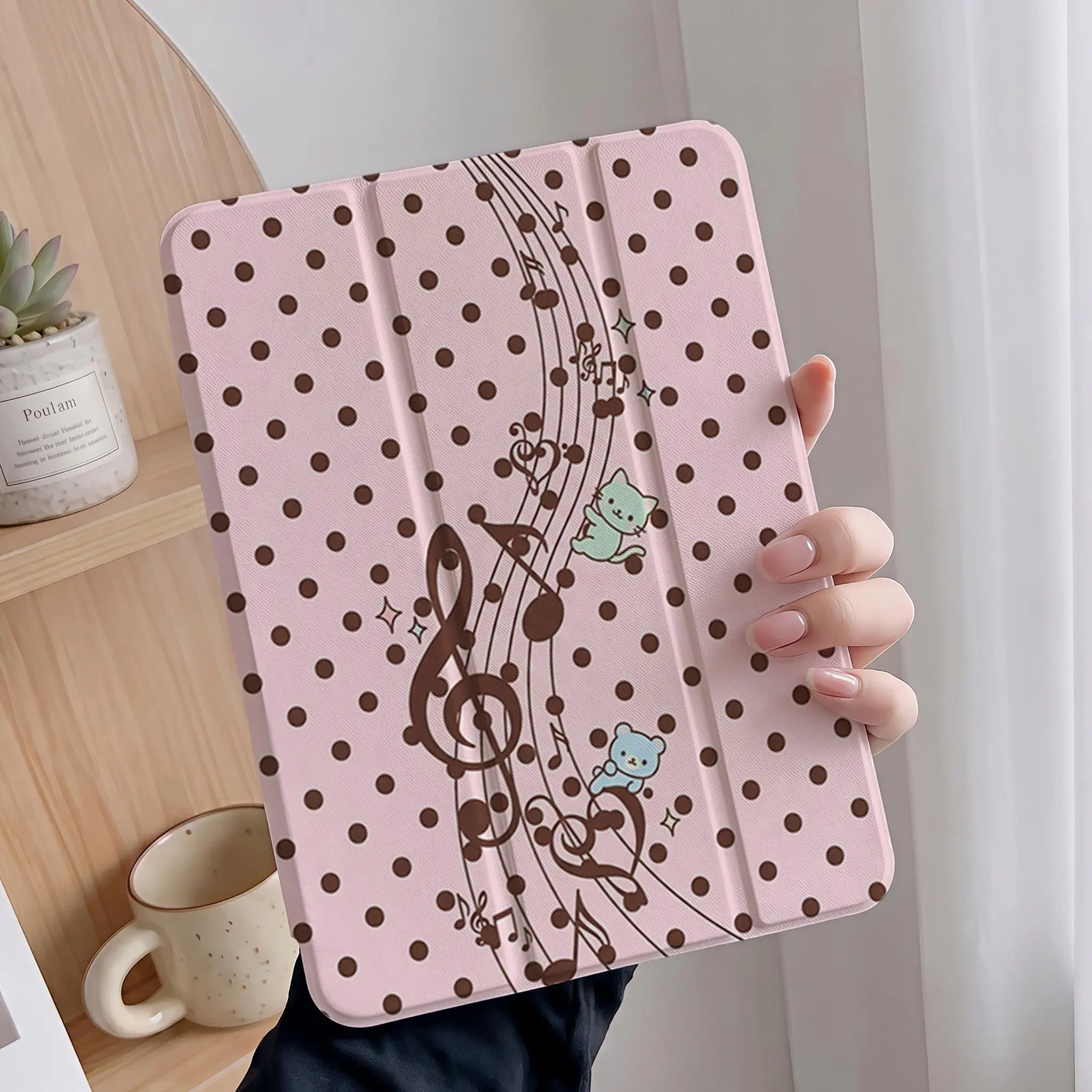 Protective case featuring a cute musical-note bear and kitten design; includes an adjustable stand, stylus holder, and foldable, non-slip TPU cover; compatible with Samsung, iPad mini, iPad Air, iPad Pro, and iPad (10th/11th Gen) series.