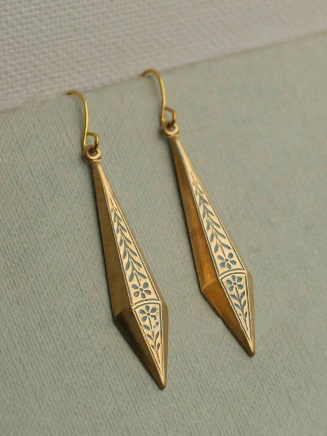 A pair of fashionable golden  color geometric triangle earrings with a retro minimalist style, suitable for women's daily wear as a gift