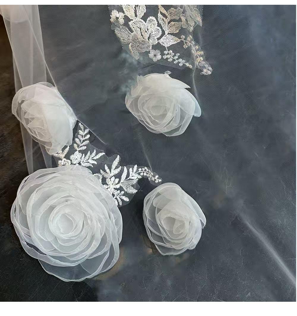 Luxury-style long veil with dreamy, elaborate floral designs and a cathedral-style train