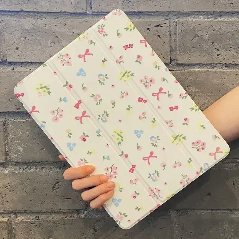 Mini wildflower and pink ribbon bow pattern iPad series protective case. Made of TPU material with automatic sleep/wake function.Suitable for iPad series tablets.