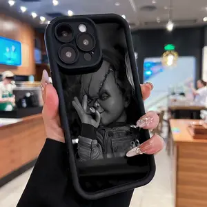Chucky smoking, black and white horror. Phone cases compatible with Samsung, Apple, VIVO, OPPO, Motorola, Google, Xiaomi, and Honor. Made of TPU silicone, they offer protection against bumps and falls.