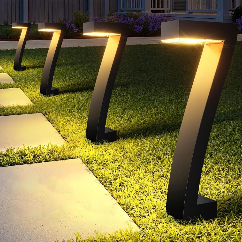 4-pack solar lights for outdoor walkways, upgraded bright LED outdoor solar lights, suitable for outdoor use, IP65 waterproof solar garden lights, suitable for courtyards, driveways, walkways, landscaping, and courtyard decoration.