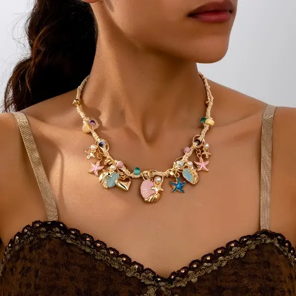 A Bohemian ocean vacation style colorful starfish, shell, and heart faux pearl beaded necklace, suitable for women to wear for everyday, vacation, or beach parties