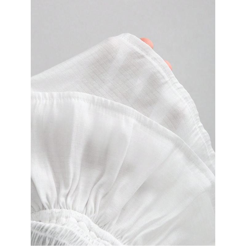 Elegant French-style sheer fabric blouse with ribbon ties and ruffled long sleeves for women, featuring ruffles, asymmetrical design, knotted detail, solid color, bell sleeves, suitable for spring, summer, and autumn