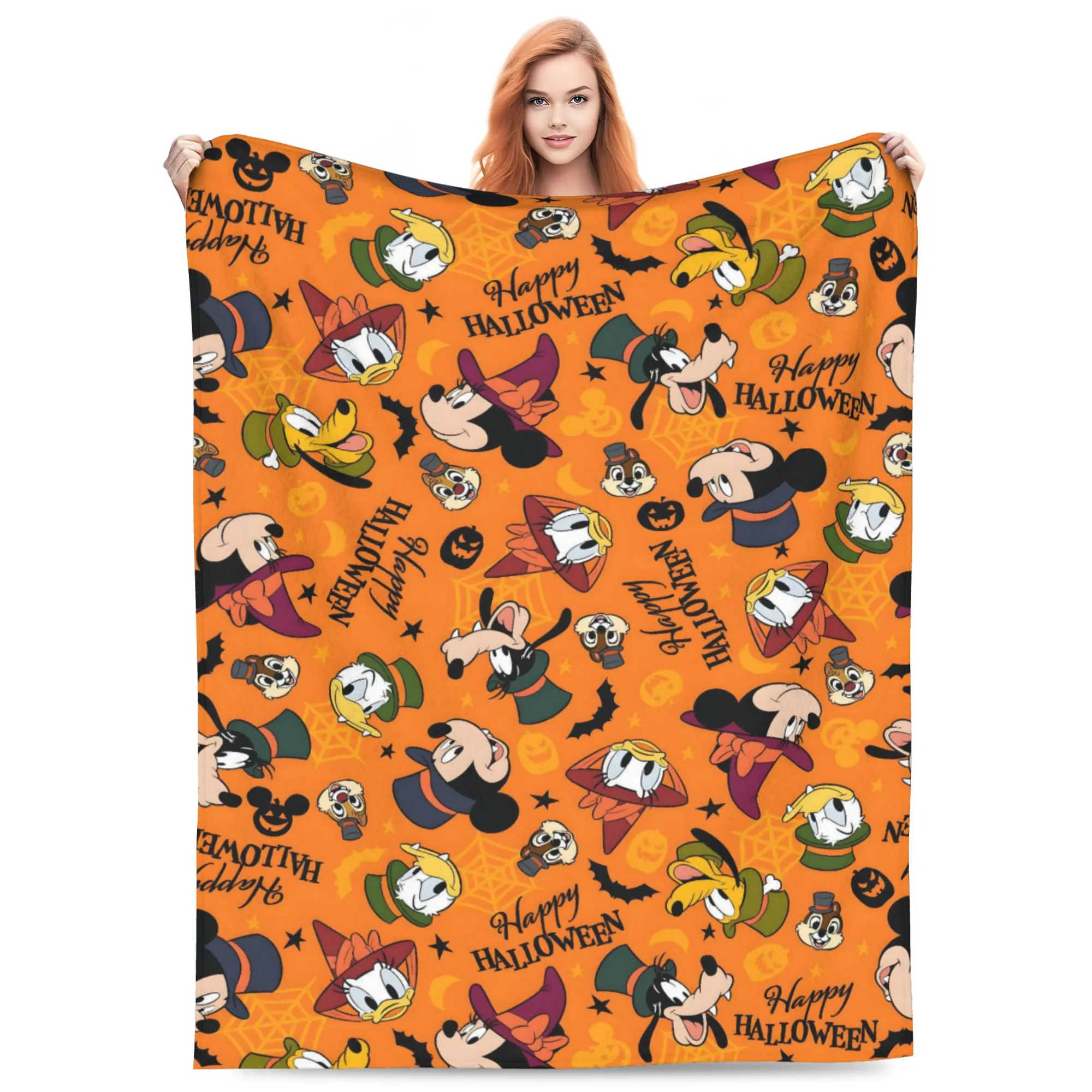 DISNEY CLASSIC Mickey Crew Halloween Flannel Blanket. Mickey, Minnie, Pluto and Donald in spooky costumes, all-over pumpkin & bat print. Soft cozy throw, seasonal gift for Disney Halloween fans.