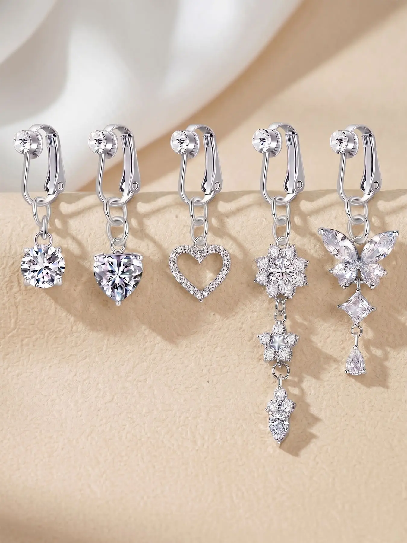 Cubic zirconia decorated non-pierced belly button ring with butterfly and teardrop design, a faux belly button piercing clip for women. Made of stainless steel, suitable for everyday wear and as a holiday gift Body Jewelry Fake Belly Rings