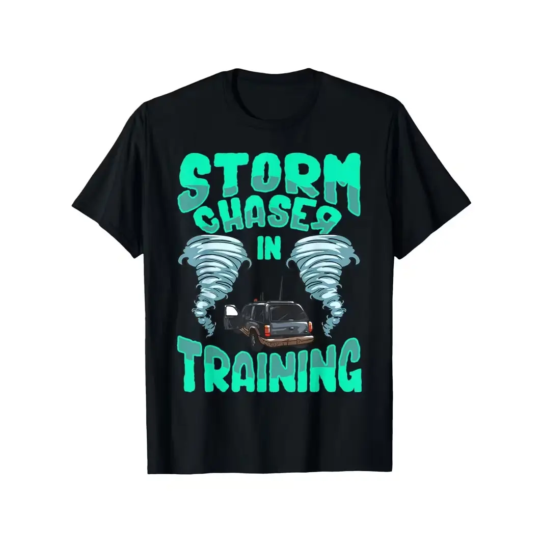 Storm Chaser in Training Graphic Tee – Tee With Bold Printed Mint-Green "STORM CHASER IN TRAINING" Typography, Twin Tornadoes Flanking a Classic SUV Adventure Vehicle, Thrill-Seeker Aesthetic, 100% Cotton, Ideal Gift For Weather Nerds & Adventure Kids, Be
