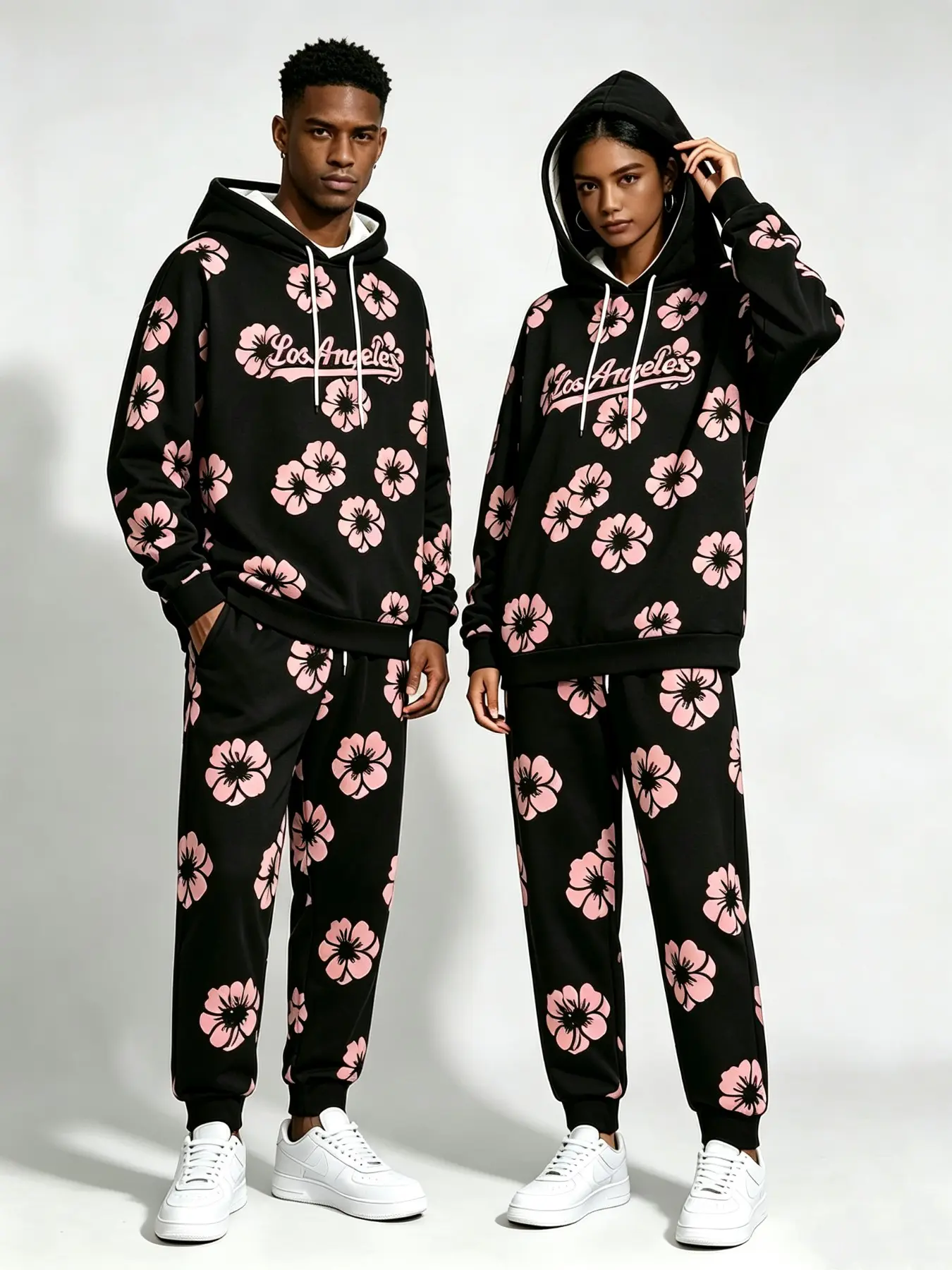 Couple All Over Floral Print Hoodie Two Piece Tracksuit Set, Letter Flower Pattern Hooded Sweatshirt & Casual Long Pants, Loose Street Style Matching Outfit For Daily Indoor And Outdoor Wear.