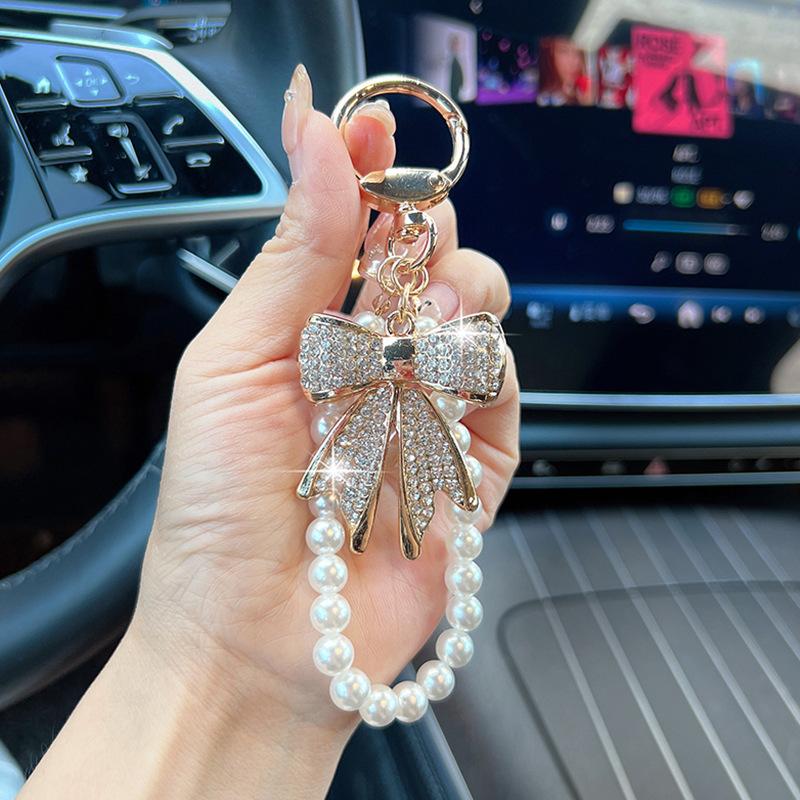 Rhinestone Bow Keychain with Pearl Wrist Strap, Luxury Bling Bow Car Key Ring, Elegant Metal Bag Charm Accessory for Women