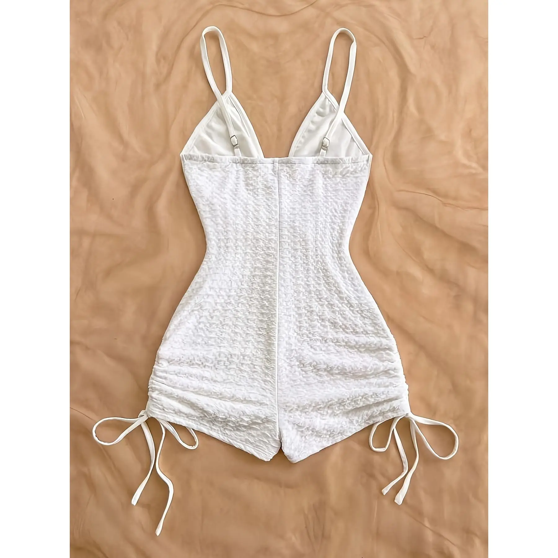 Solid Color Strappy Deep V Bodysuit with Adjustable Buckle, Featuring Side Drawstrings and Round Ring Embellishments.Elegant and Graceful, Suitable for Halloween, Christmas, Holiday Outings, and Other Occasions.A Vintage-style Sexy Bodysuit