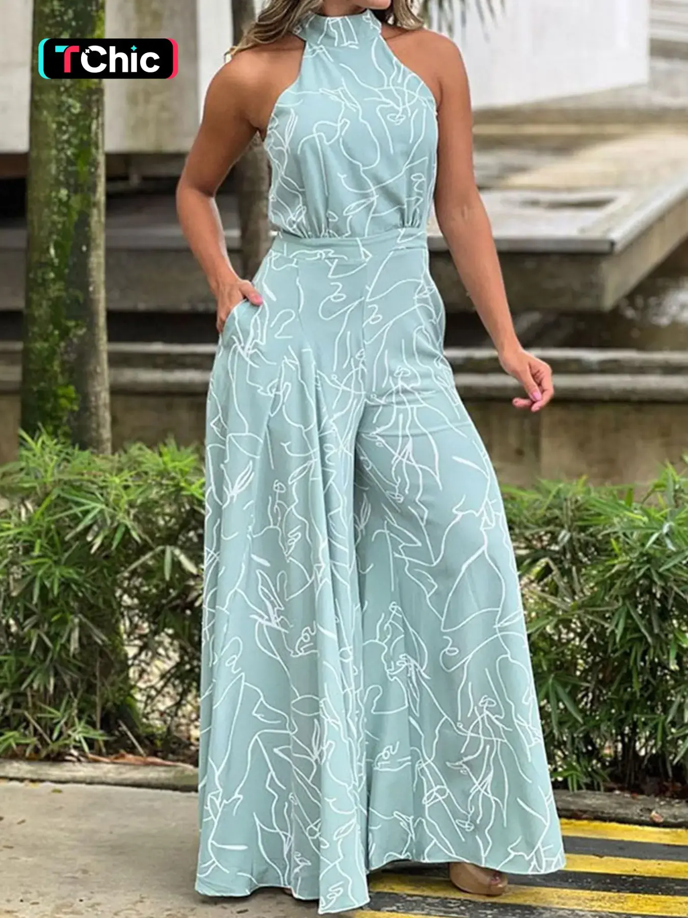 Elegant High-Waisted Wide-Leg Romper Jumpsuit, Artistic Print Halter Neck Design, Slimming Effect, Perfect for Vacation Style
