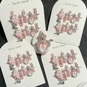 1Set, TRUTH AMOR Pink Paw Cross Press On Nails,10Pcs Long Taper Shape, Milk Pink Base, 3D Paw Crown Wing Heart Lock Rhinestone Metal Charms, Easy Wear For Sweet Gothic Outfit, ViralKawaiiNail, CuteGothManicure, PortableNailDecoration