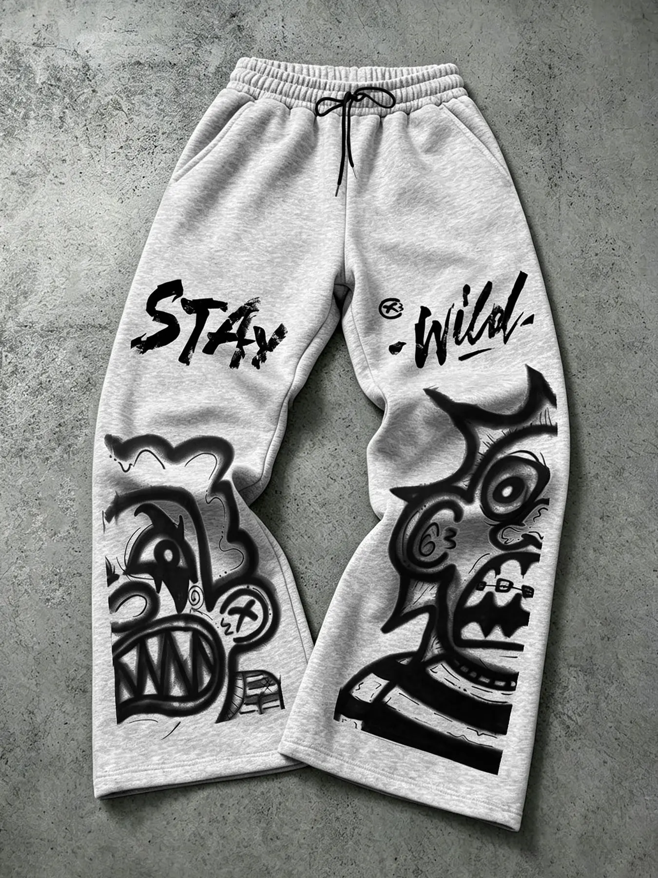 Men's Casual Wide-Leg Athletic Sweatpants, Featuring Graffiti Monster and Letter Prints, Drawstring Elastic Waistband, Millennial Hip-Hop Street Style, Suitable for Skateboarding and Everyday Street Wear.