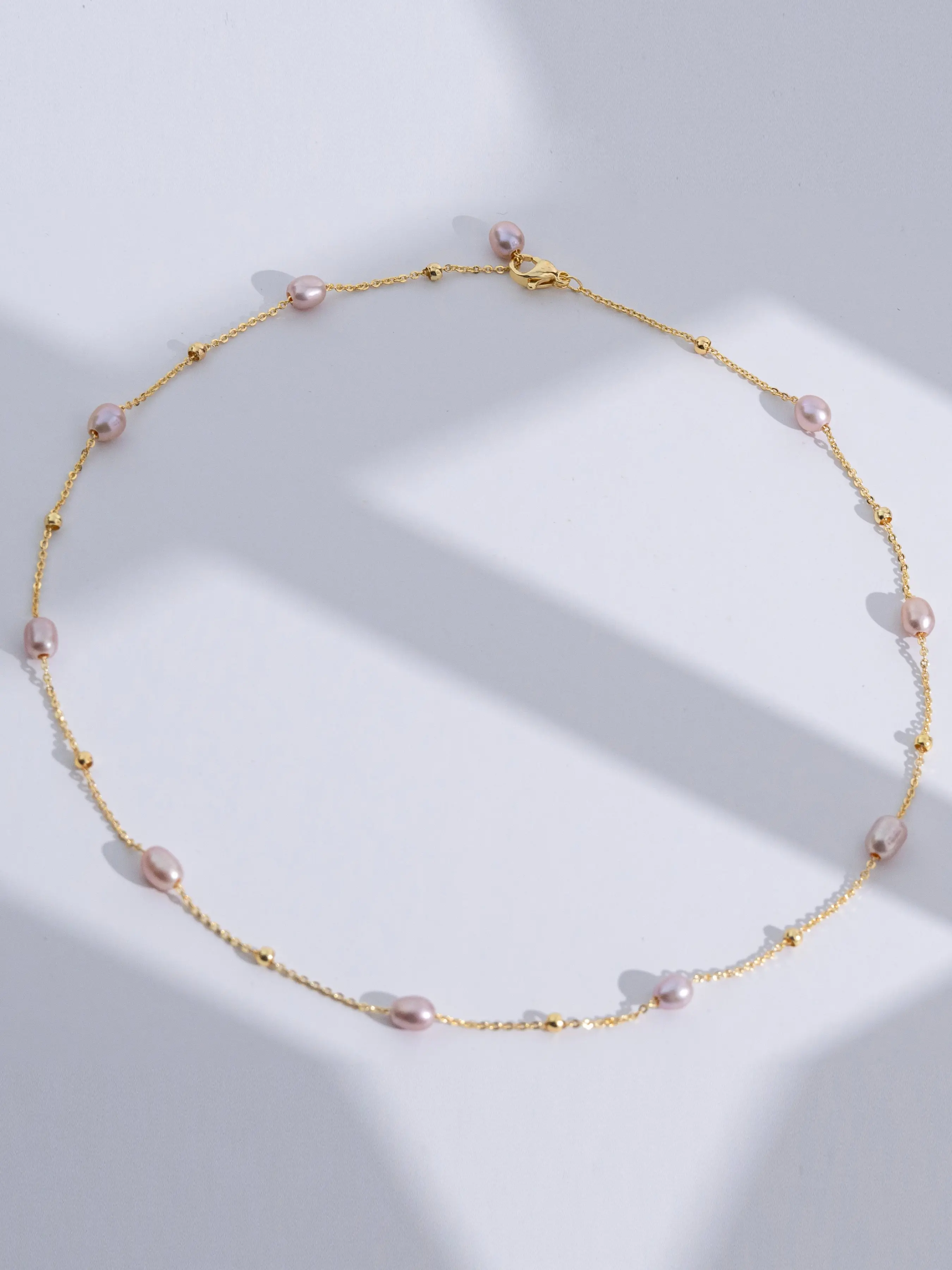 Freshwater Seedless Rice-Shaped Pearl Starburst Necklace 5-6mm, Near Round with Minor Imperfections, Alloy Chain, Model SY13702, Dainty Pearl Necklace