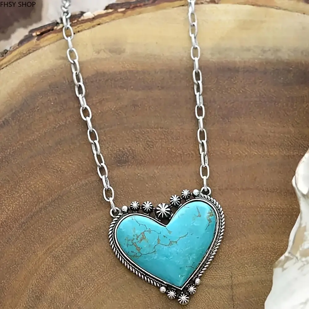 Western jewelry | Hot selling large turquoise heart necklace with silver accents | Hard-to-find bohemian-style statement pendant | Natural turquoise matrix, intricate silverwork, great for gifting, country-themed events and adding a bold western touch