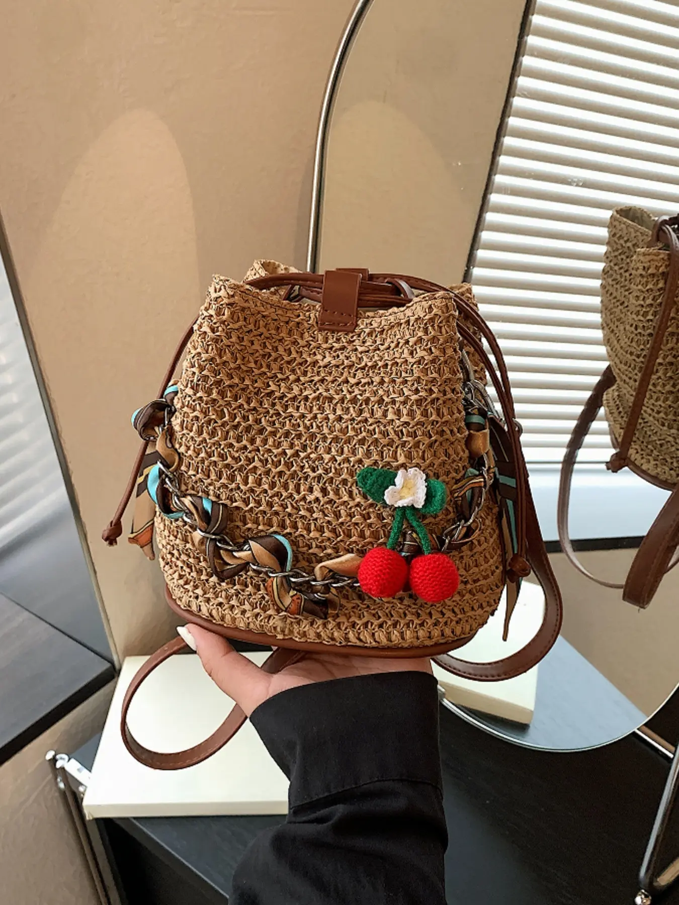 Sweet and cute crochet cherry blossom flower pendant, lightweight luxury straw drawstring bucket bag, detachable and adjustable shoulder strap for daily commute or vacation style shoulder/crossbody bag.