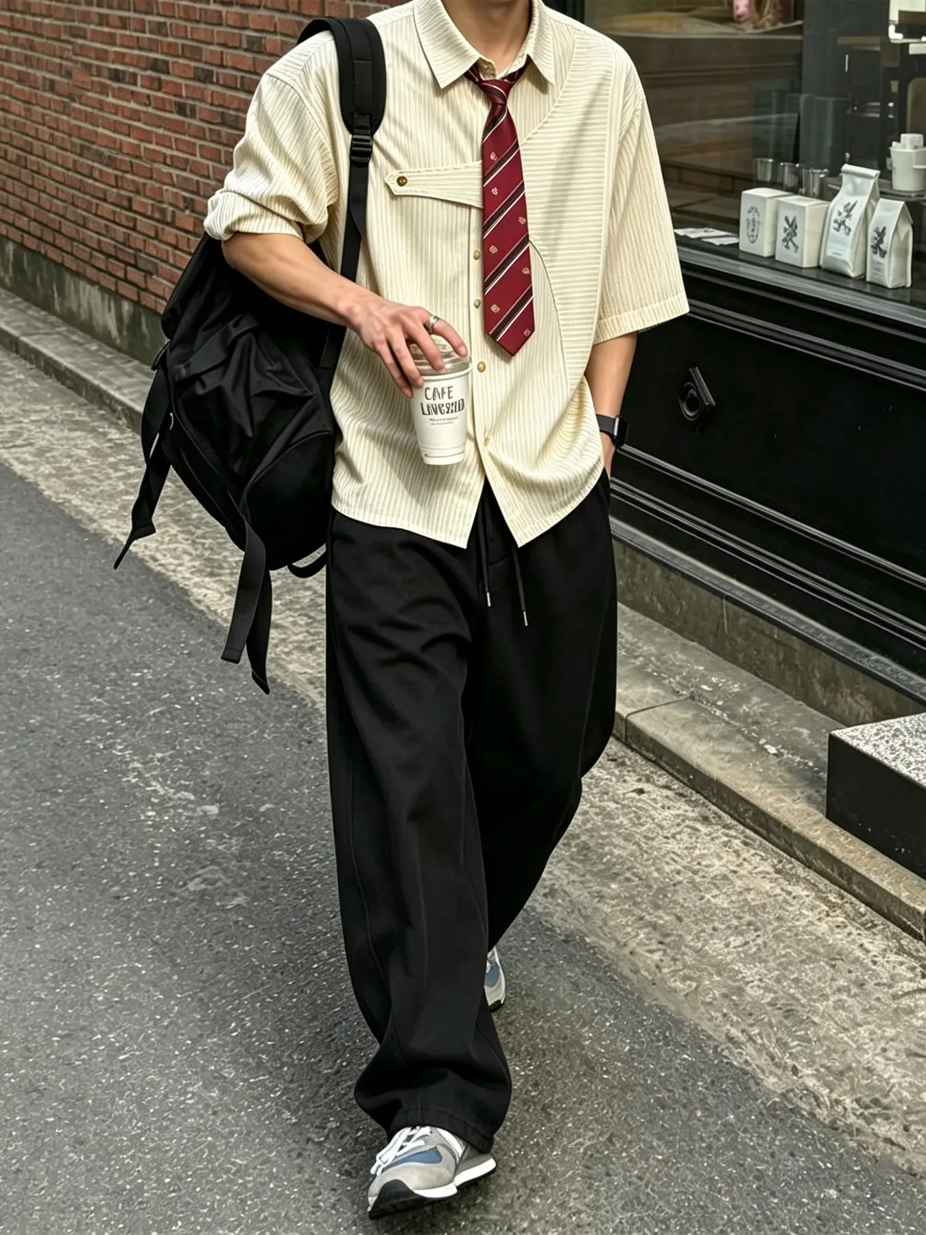 Men's Stylish Striped Short-Sleeved Shirt with Tie + Black Drawstring Wide-Leg Trousers Suit, a Casual Street Style Suitable for Everyday Street Scenes.