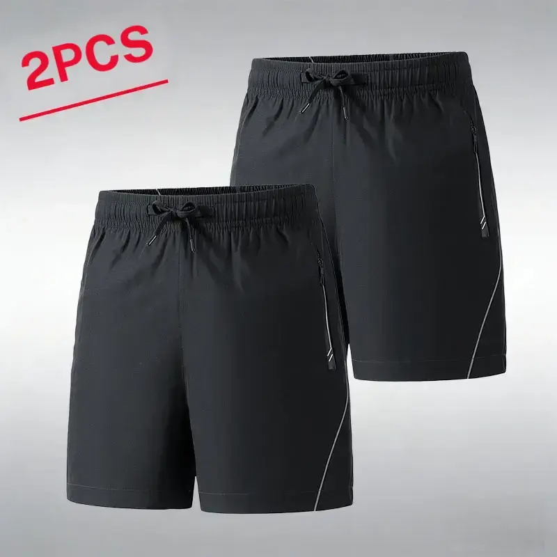 Men’s summer essential 2 pack athletic shorts—casual commuter sporty style. Made from breathable ice silk that feels cool against the skin and wicks away sweat, with zippered pockets for secure storage of phones and keys. Side reflective stripes enhance s